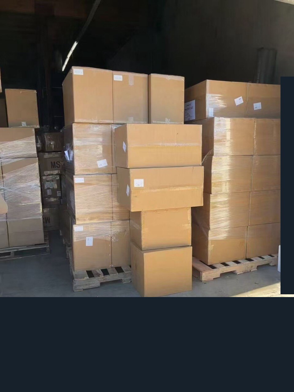 Cartons of men's boots delivered in Los Angeles after five-day Air DDP shipping from Foshan