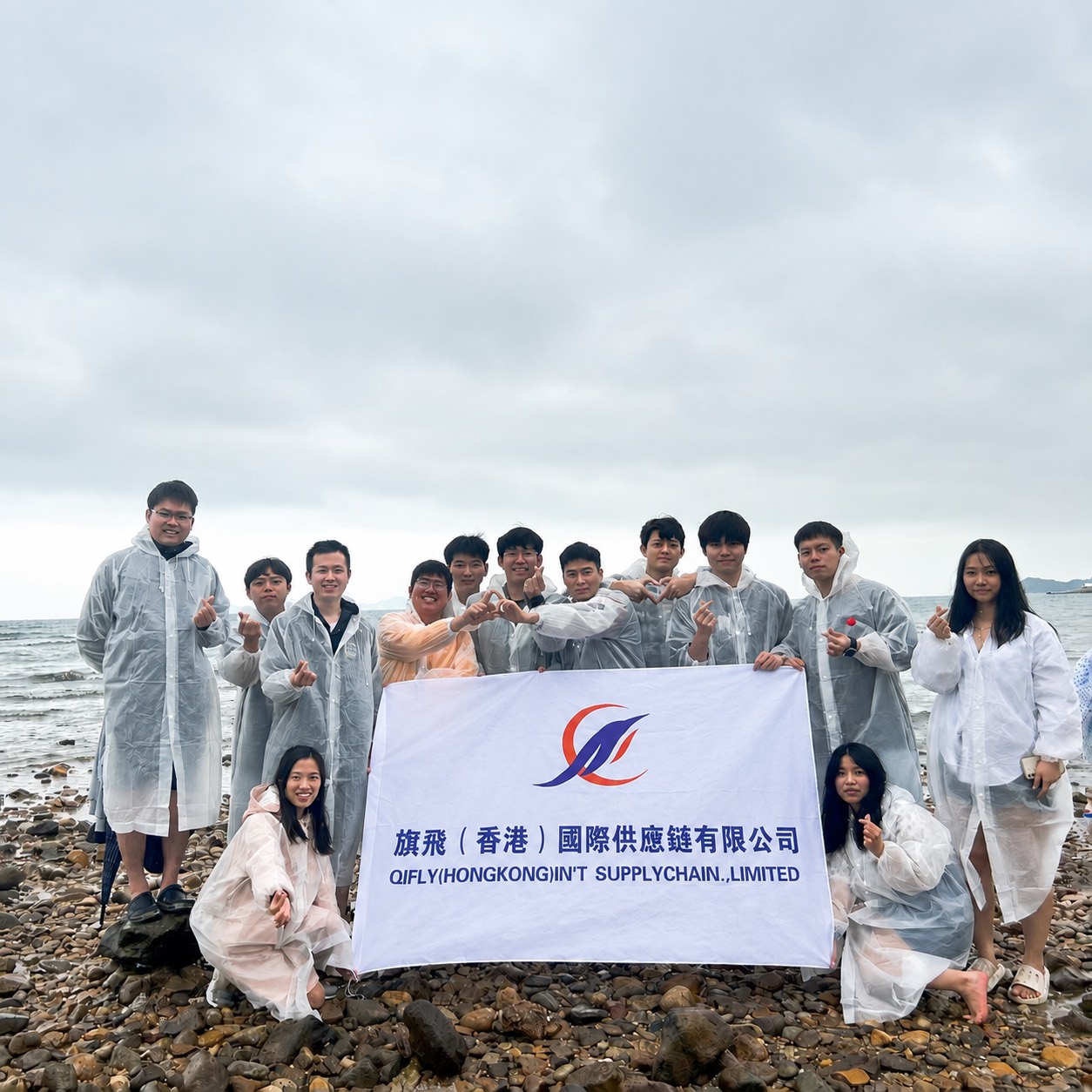 QIFLY Hong Kong team gathering together by the sea